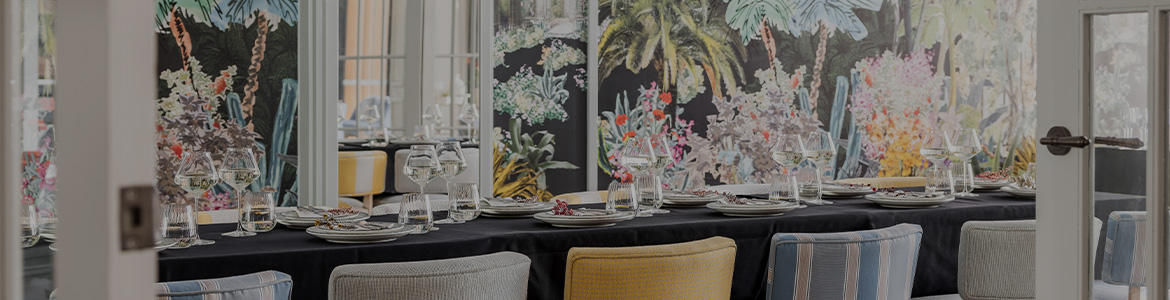 Coloured chairs at a table